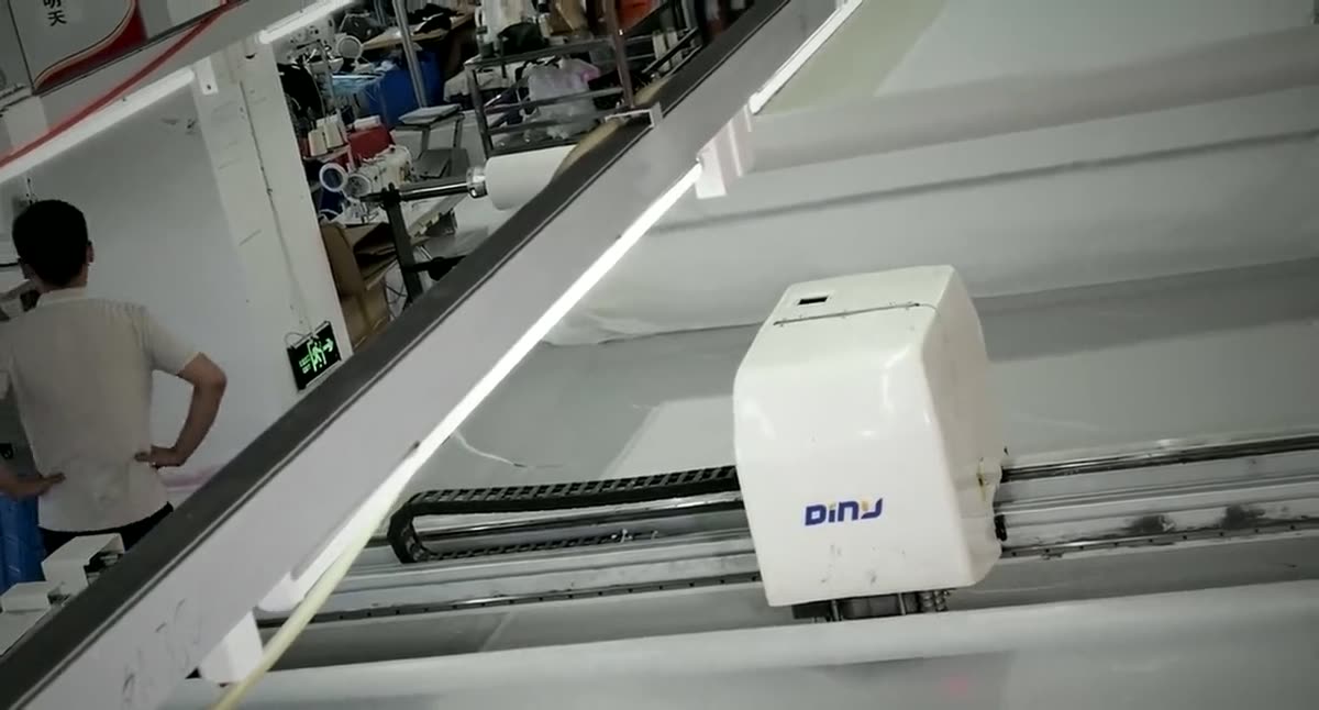 Automated fabric spreading and cutting